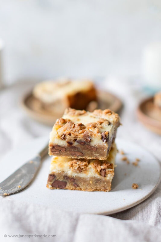 Two Cheesecake Cookie Bars stacked on top of each other