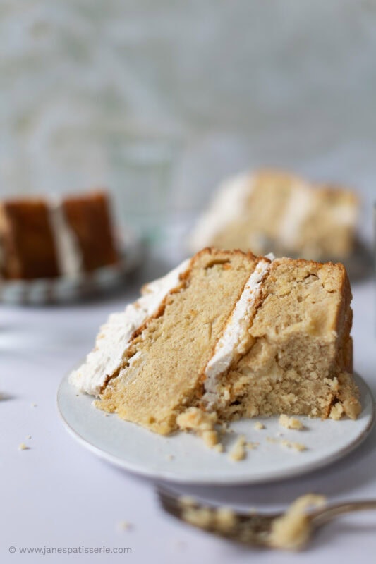 a slice of apple crumble cake with a bitsize chunk missing