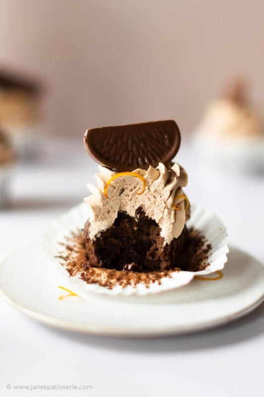 A bite missing from a single Chocolate Orange Cupcake