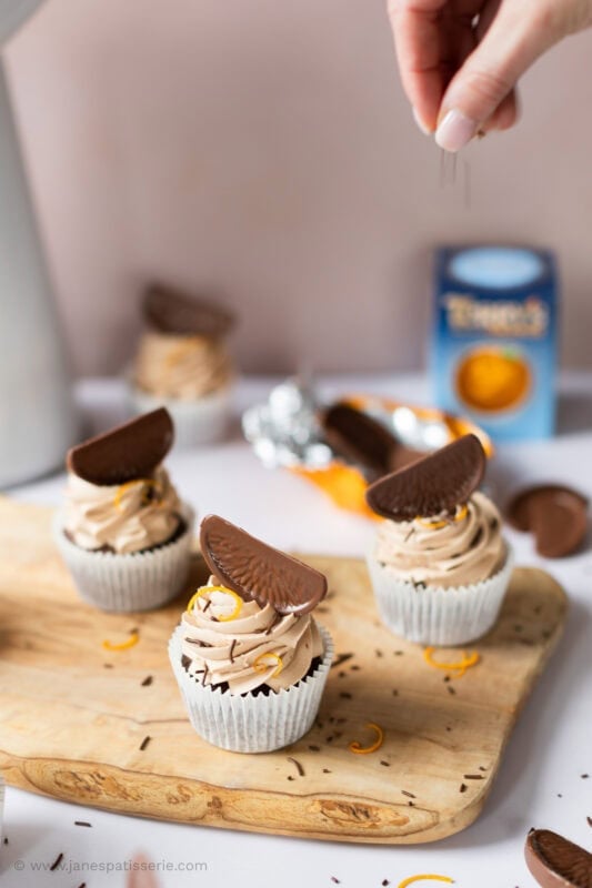 A selection of Chocolate Orange Cupcakes on a chopping board