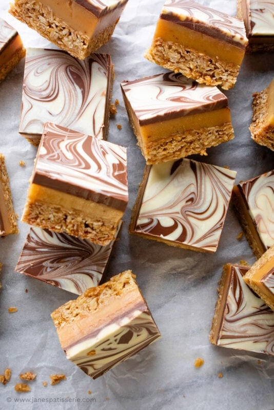 Piled millionaires flackjacks in rows showing the feathered chocolate