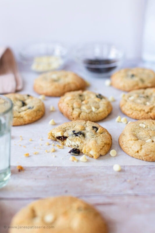 A White Chocolate and Cranberry Cookie on parchment paper