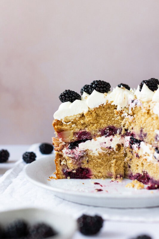 Cut two-layer apple blackberry crumble cake, slice missing