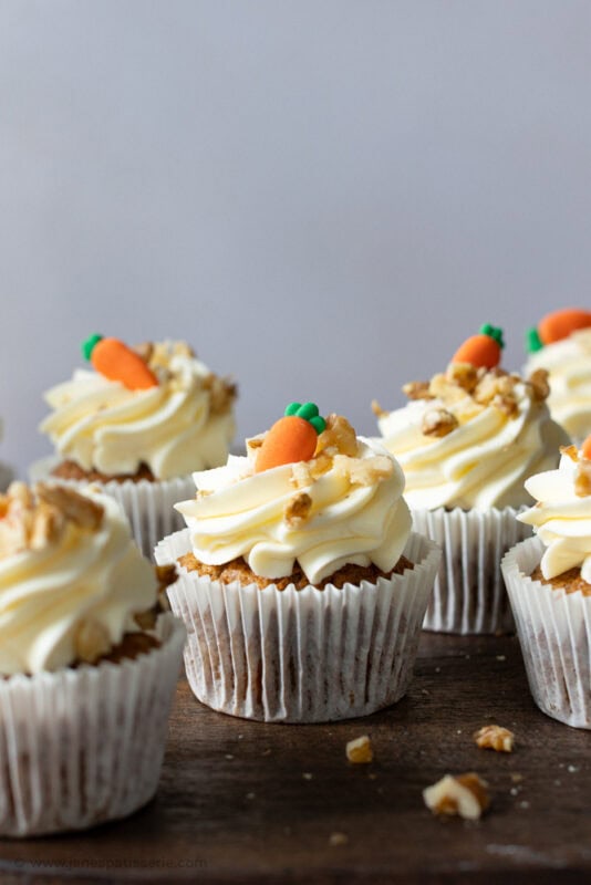 A carrot cake cupcake in a white cupcake case