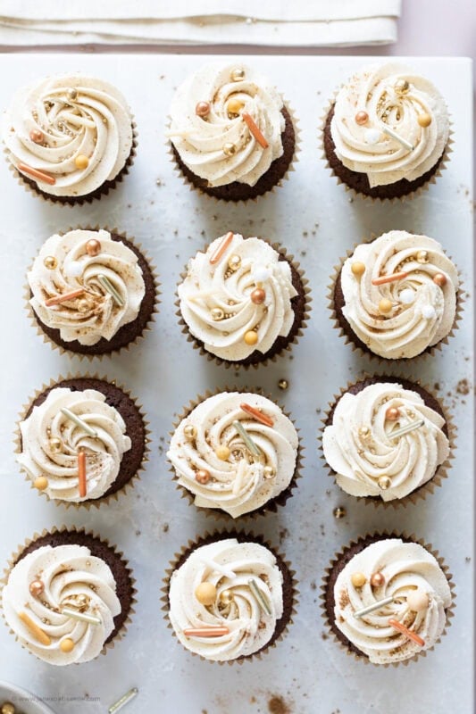 A row of chocolate chai cupcakes on a board