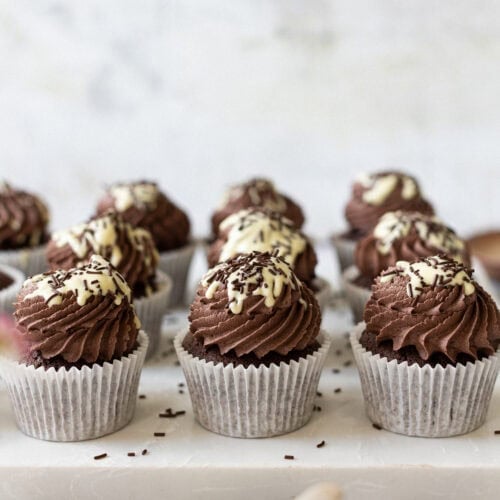 Delicious chocolate cupcakes with white chocolate drizzle