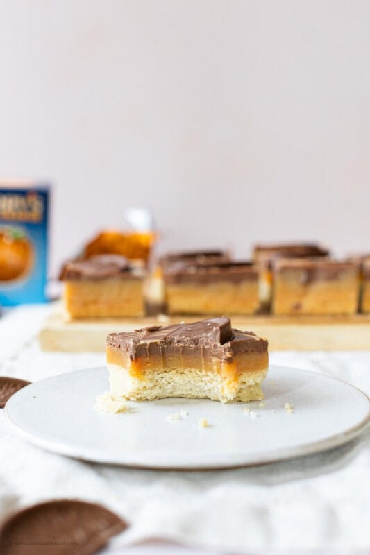 A bite missing from a plated Chocolate Orange Millionaires