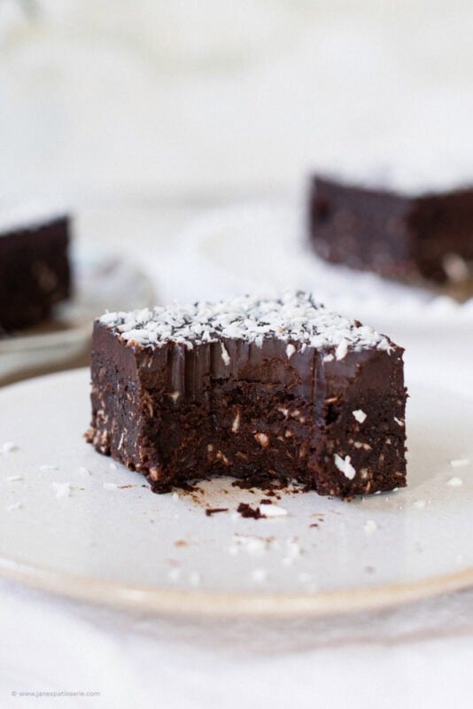 A bite missing from a coconut brownie