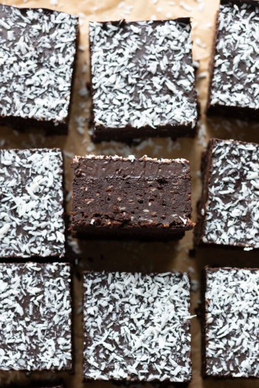 A coconut brownie turned on its side to show middle