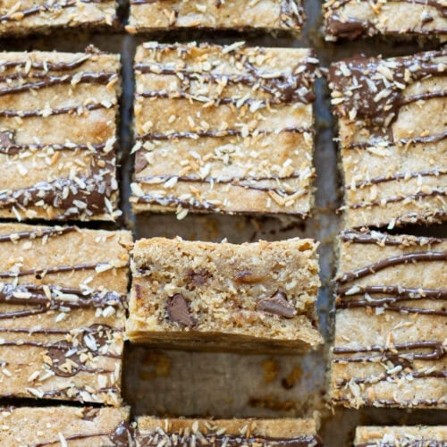 Coconut Chocolate Blondies on a chopping board