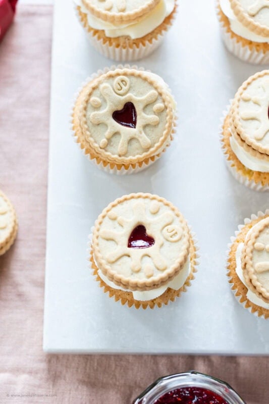 A row of Jammie Dodger Cupcakes on a chopping board