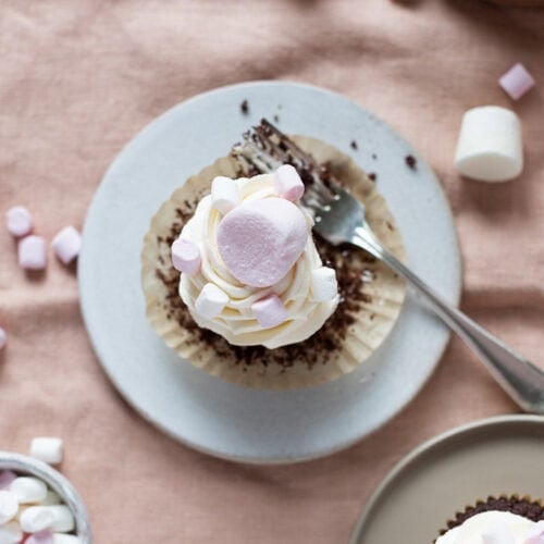 A top down shot of a marshmallow cupcake on a plate