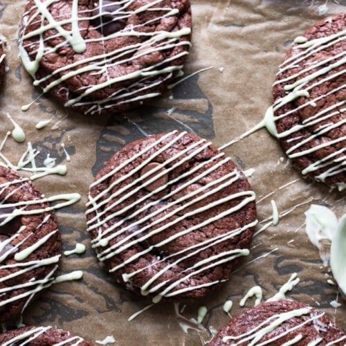 A top down shot of mint chocolate chip cookies on a baking tray