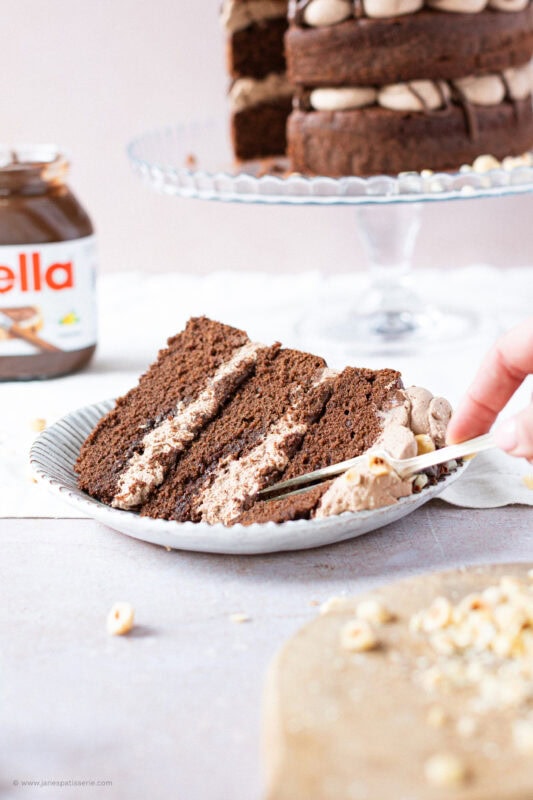 A fork cutting into a slice of Nutella Cake