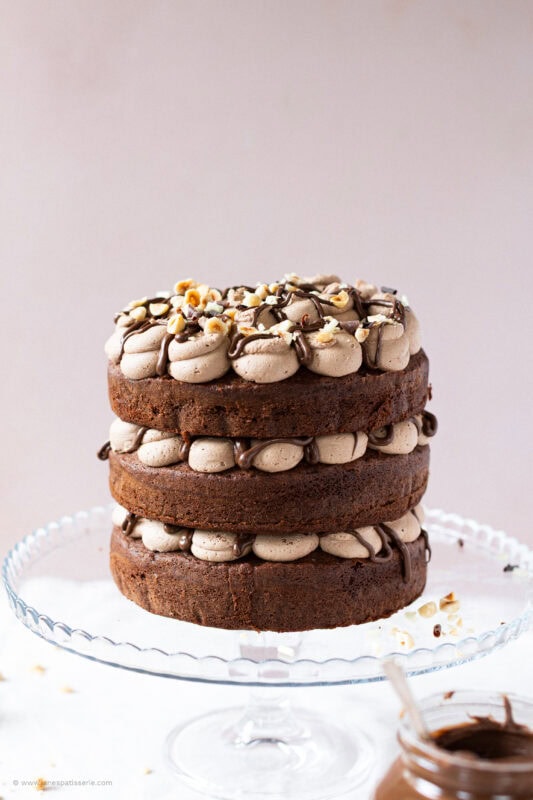 A whole Nutella Cake on a cake stand