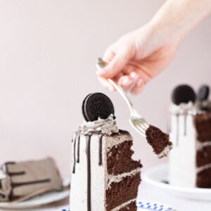 A fork cutting into an Oreo Drip Cake