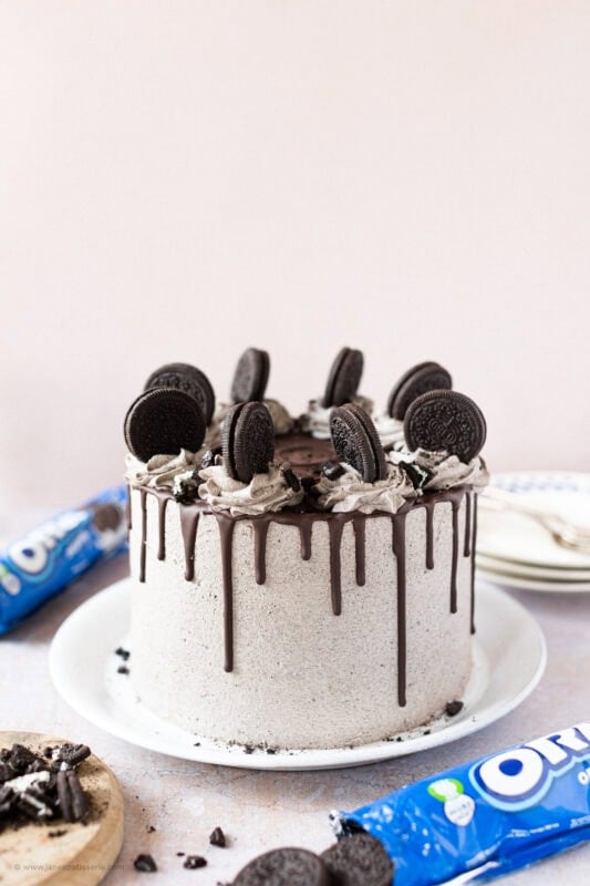 Oreo Drip Cake surrounded by packs of Oreos