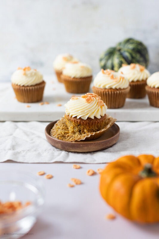 An unwrapped Pumpkin Cupcake on a plate