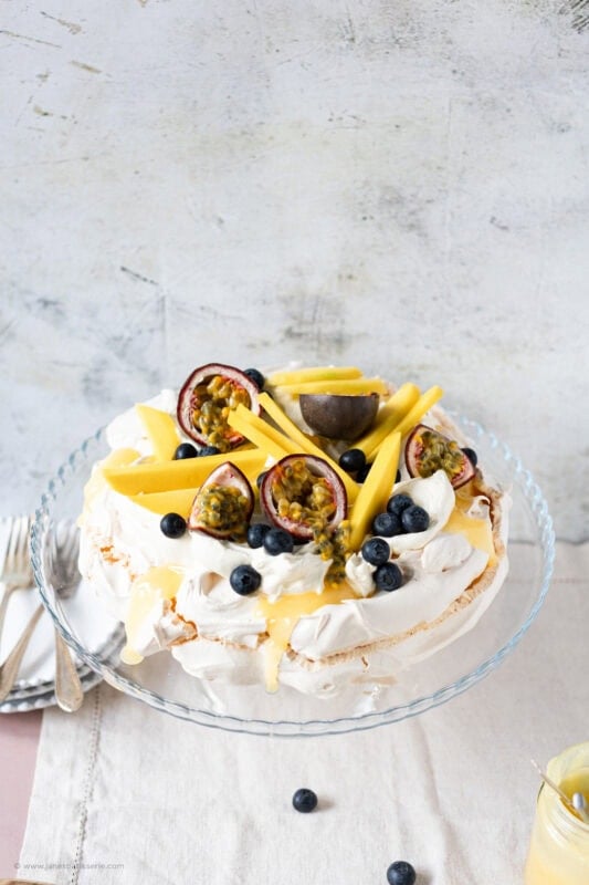 A whole Spring Pavlova on a cake stand