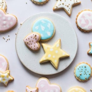 A plate of brightly decorated Sugar Cookies on a plate