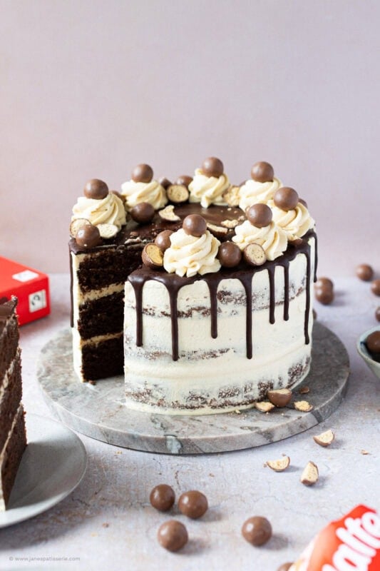 A slice taken from the Malteser Drip Cake