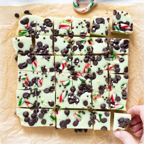 A hand taking a slice of Peppermint Fudge