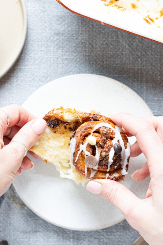 Unravelling a Sticky Chocolate Sweet Roll on a plate