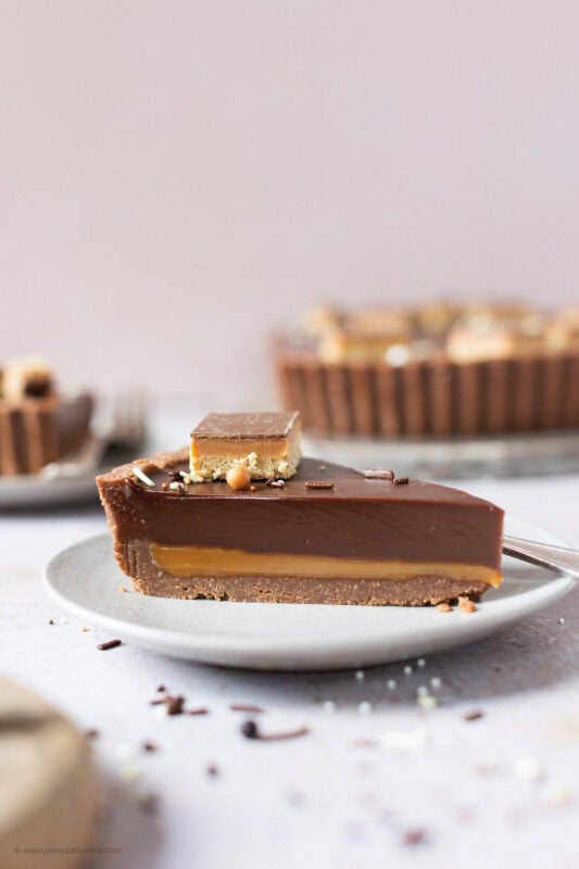 A slice of Billionaires Tart on a plate