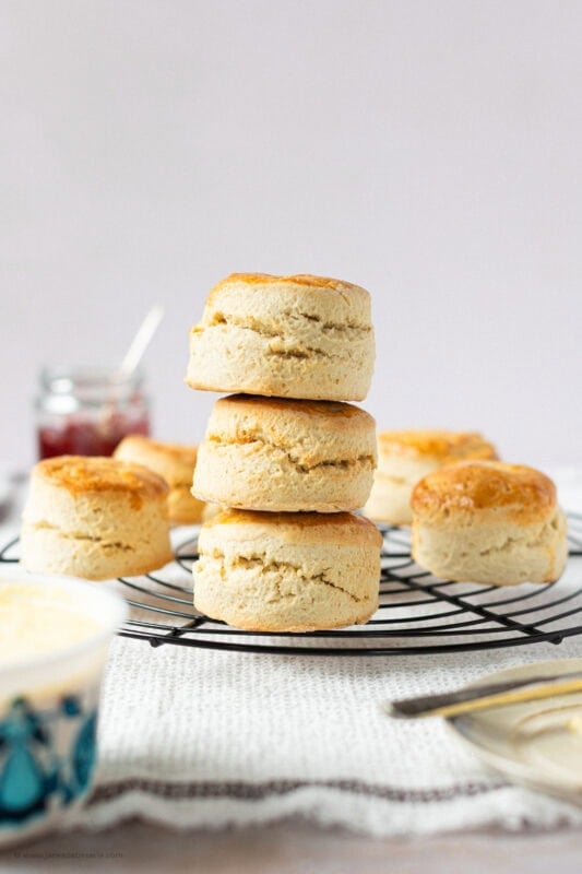 A stack of three Classic Buttery Scones on a cooling rack