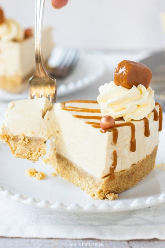 A fork cutting into a slice of Butterscotch cheesecake