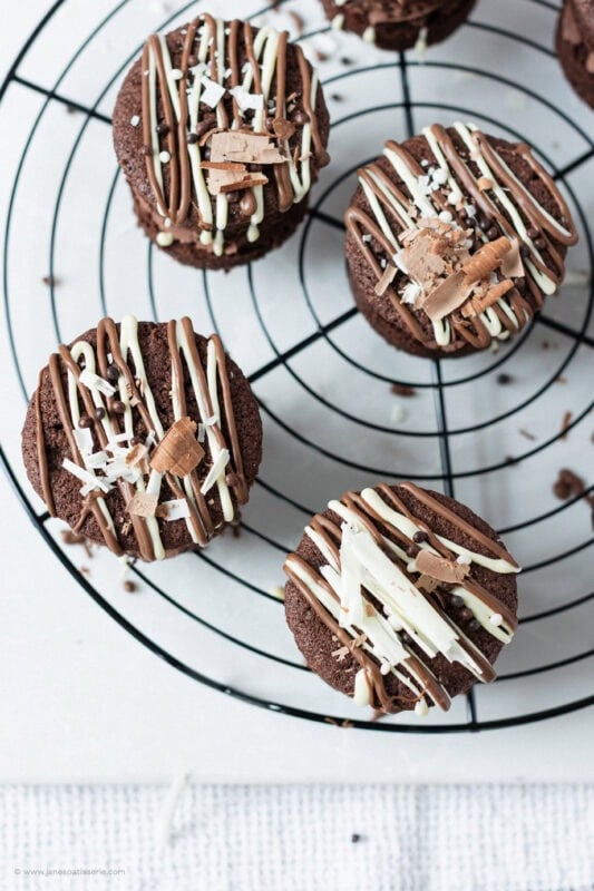 A top down shot looking above a selection of Mini Chocolate Cakes on a wire rack