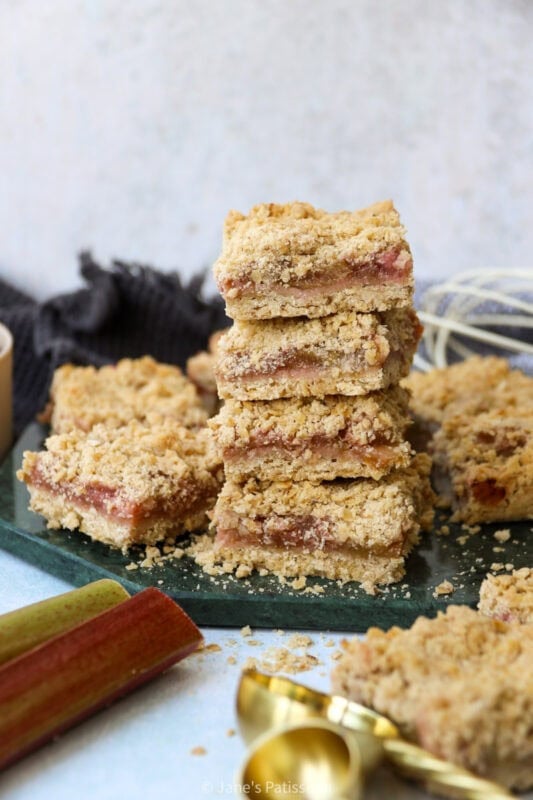 Stacks of Rhubarb Crumble Bars on a chopping board