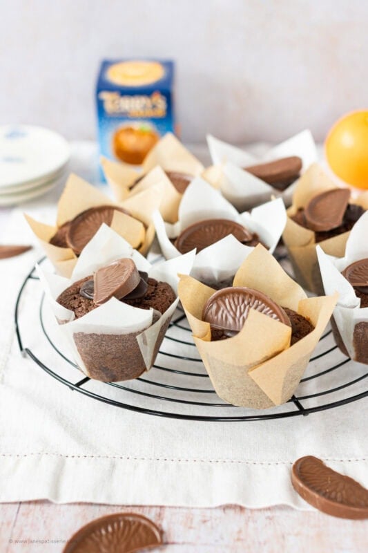 A cooling rack of Chocolate Orange Muffins