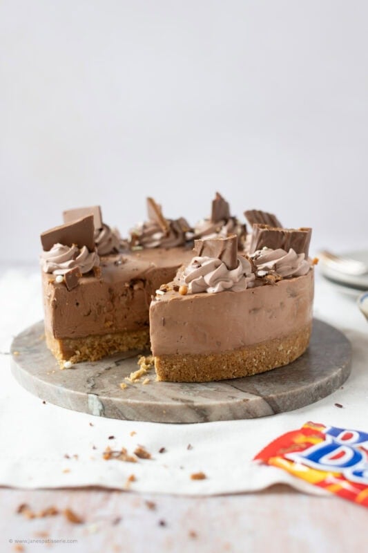 A slice missing from a No-bake Daim Cheesecake