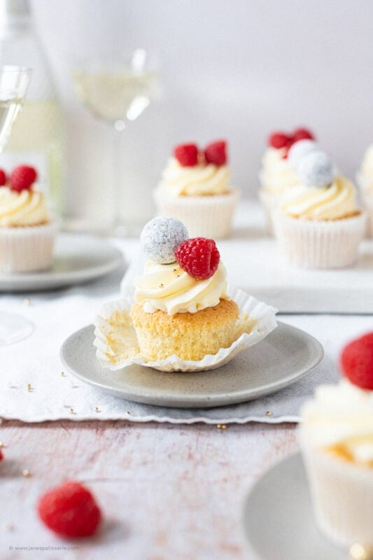 An unwrapped Prosecco Cupcake on a plate