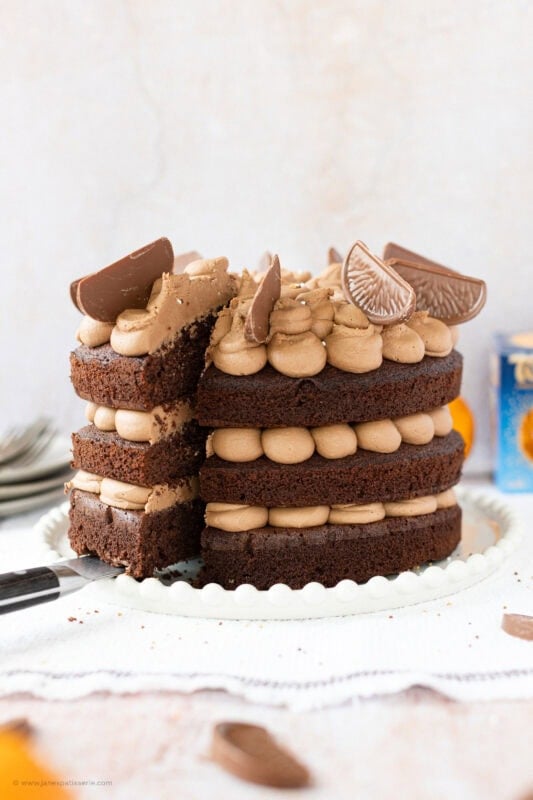 A slice being cut into a Terrys chocolate orange cake
