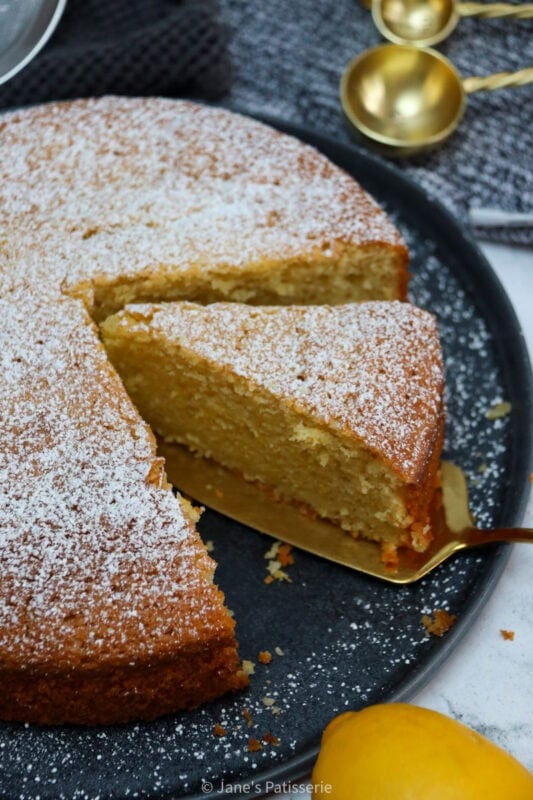 Multiple slices being taken from a Lemon Olive Oil Cake